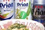 ジャストタイミングで沖縄から送ったオリオンビールが届いた。左からドラフト、麦職人、辛口。手前はゴーヤ